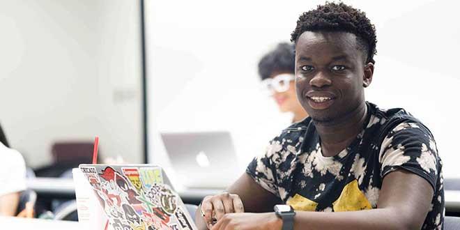 student working on a laptop.